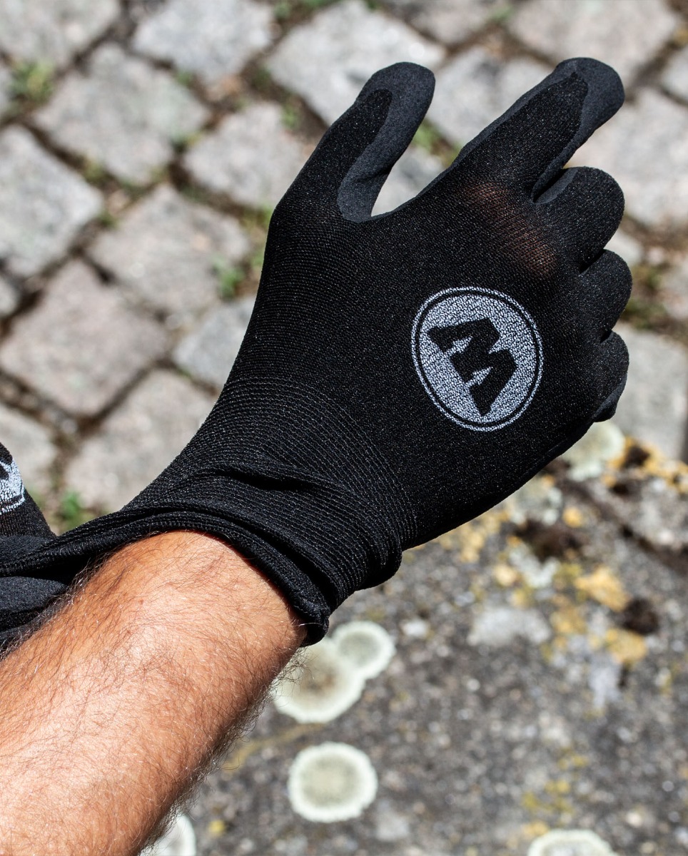 Hand wearing a black Molotow protective glove